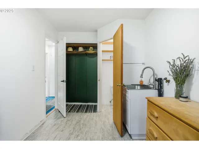 a kitchen with a refrigerator and a sink