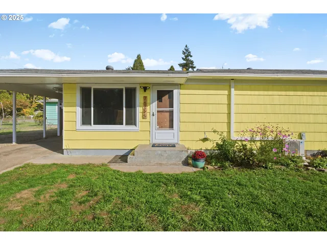 a front view of a house with a yard