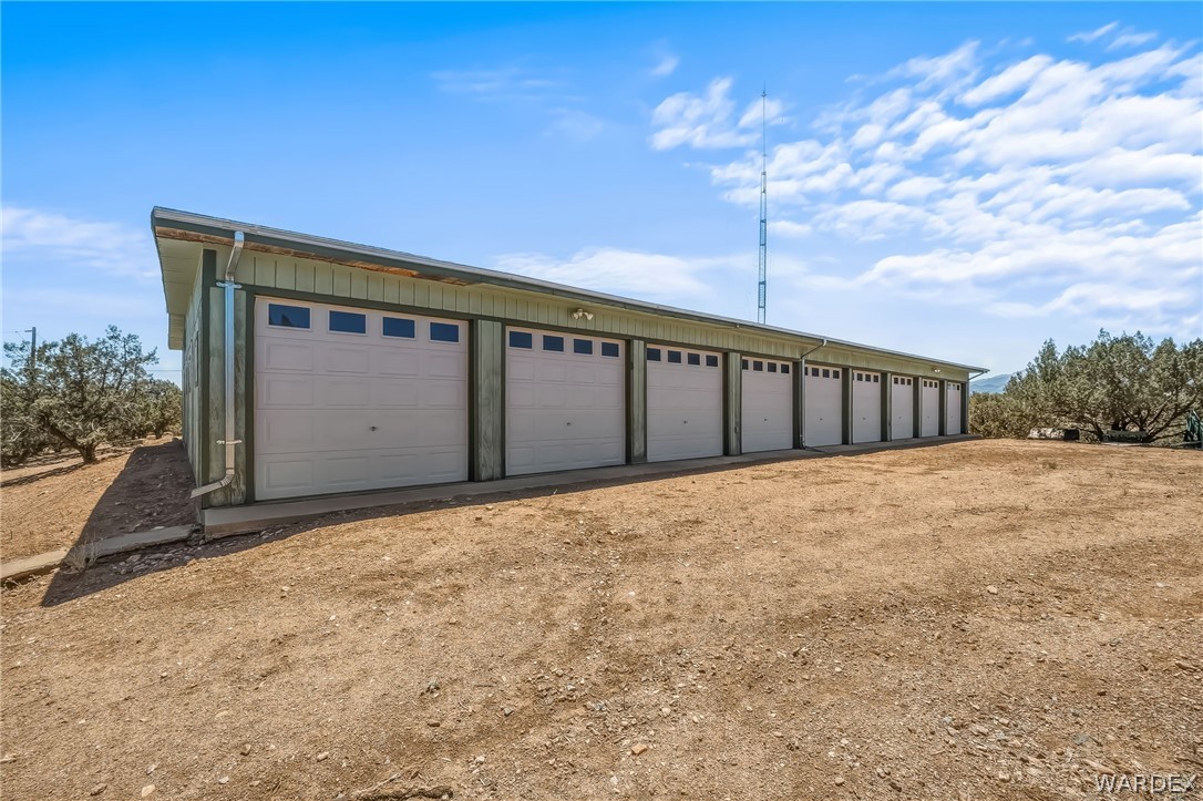 2401 North Stephan Road Kingman, AZ 86401 - Photo 17 of 92 Multi-bay garage structure featuring eight individual garage doors with transom windows