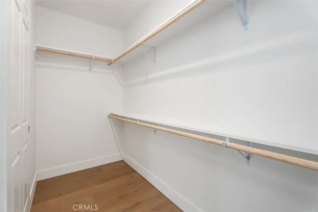 a bathroom with double sink shower and a mirror