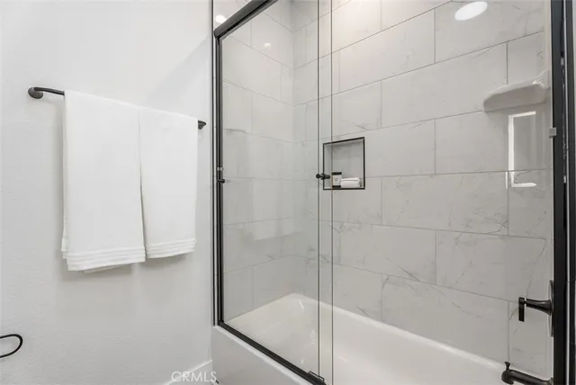 a bathroom with a sink toilet and a mirror