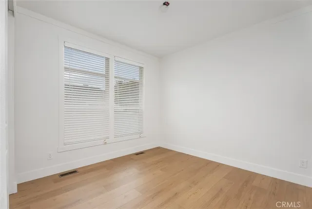 a work room with furniture and a window