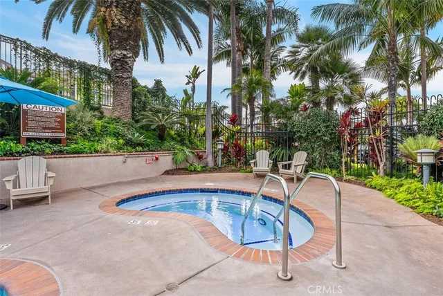 a view of a house with swimming pool and sitting area