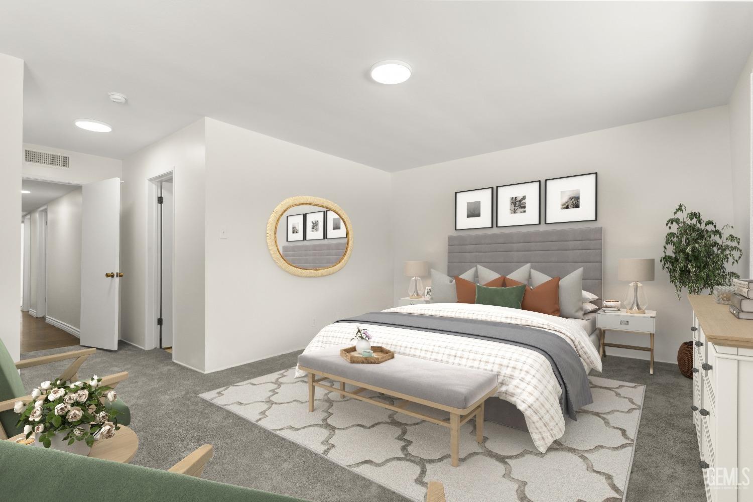 Undisclosed Address Bakersfield, CA 93309 - Photo 16 of 23 a bedroom with a bed and a chandelier