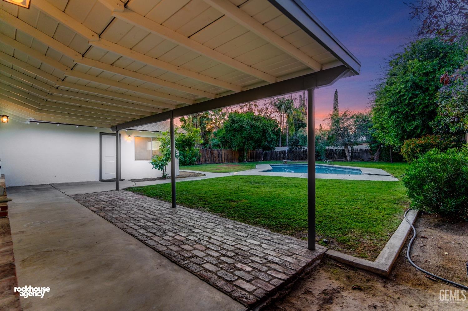 Undisclosed Address Bakersfield, CA 93309 - Photo 19 of 23 a view of a backyard with a garden