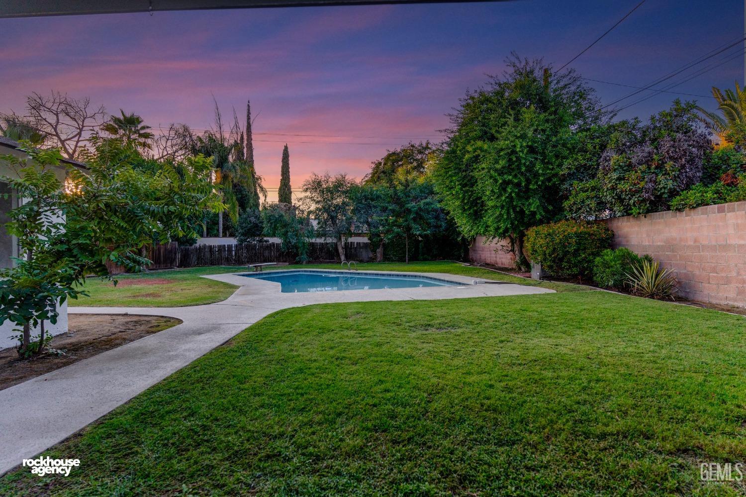 Undisclosed Address Bakersfield, CA 93309 - Photo 20 of 23 a view of yard with swimming pool and green space