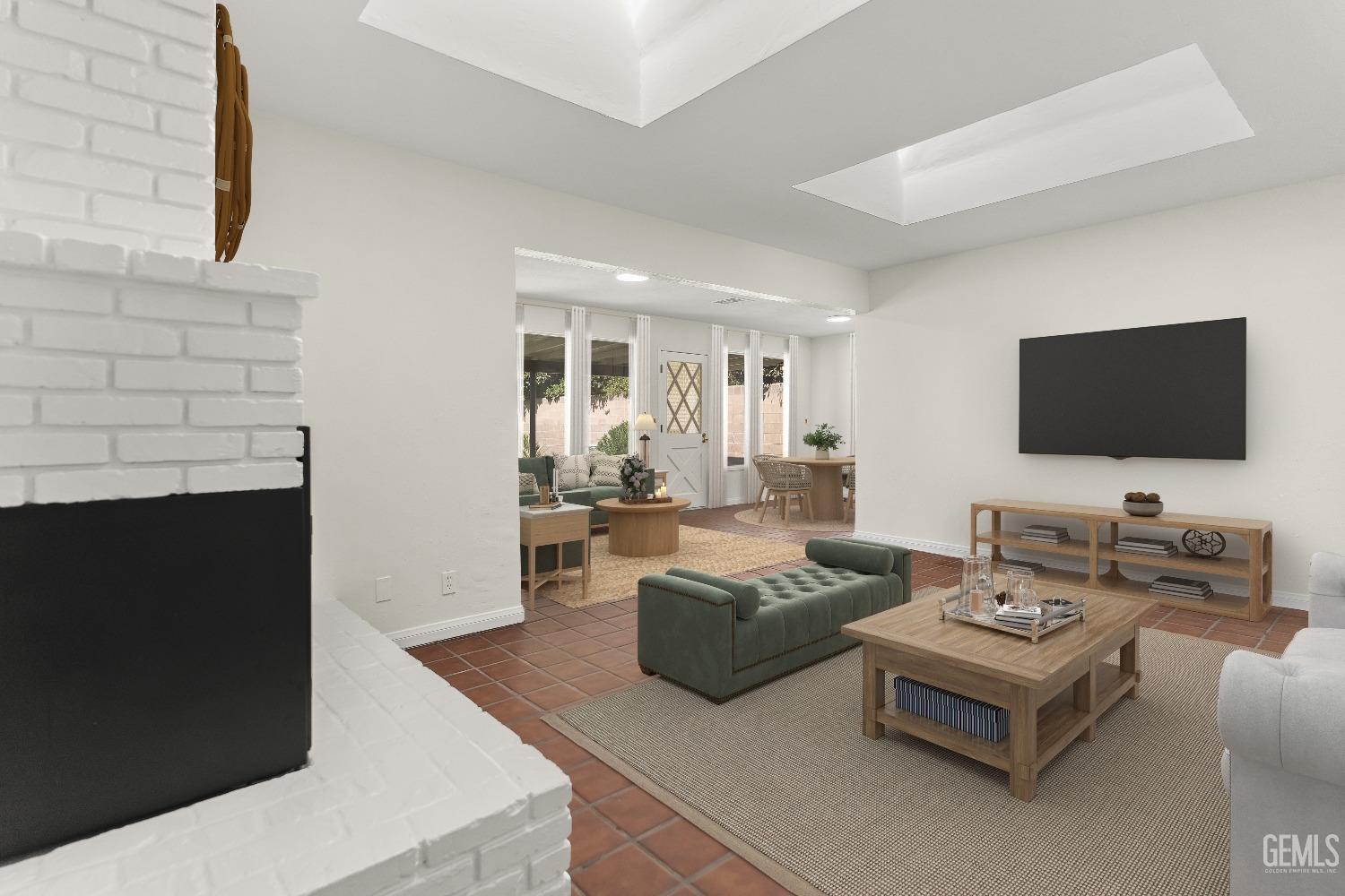 Undisclosed Address Bakersfield, CA 93309 - Photo 8 of 23 a living room with furniture and a flat screen tv