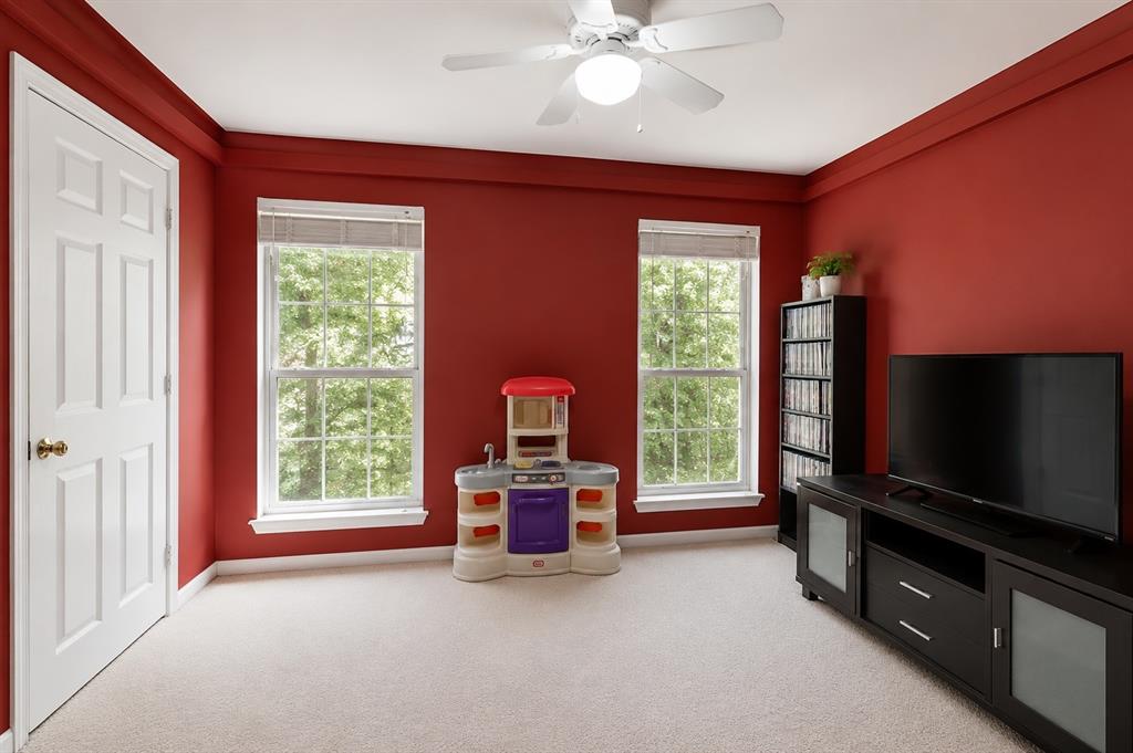 1508 Valley Creek Road Denton, TX 76205 - Photo 28 of 33 a living room with furniture windows and a flat screen tv