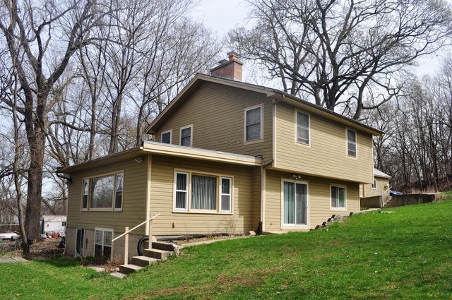 1020 Robertson Road South Elgin, IL 60177 - Photo 1 of 11 a front view of house with yard and green space