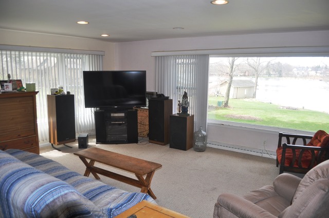 1020 Robertson Road South Elgin, IL 60177 - Photo 2 of 11 a living room with furniture and a flat screen tv