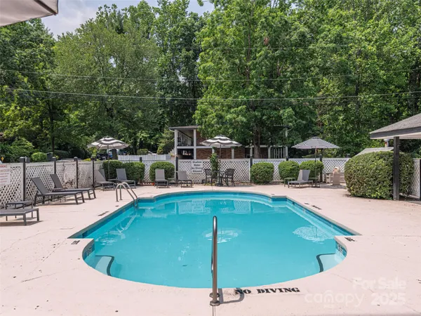 a view of a swimming pool with a patio