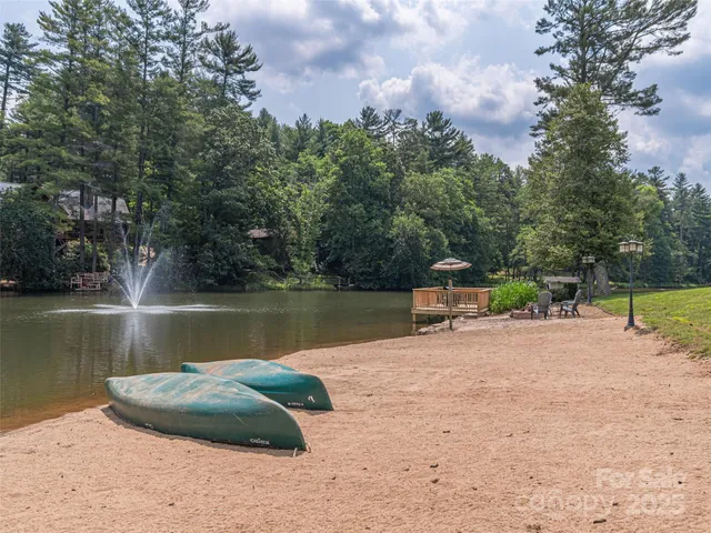 a wooden bench sitting next to a lake