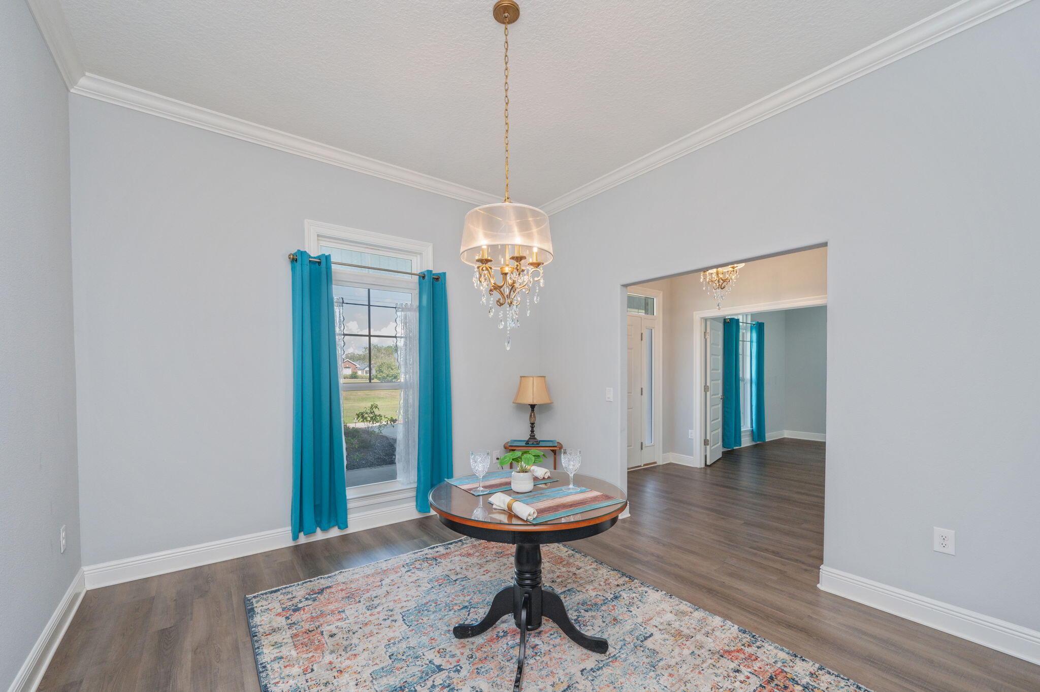 6125 Quintette Road Pace, FL 32571 - Photo 12 of 71 a room with furniture and wooden floor