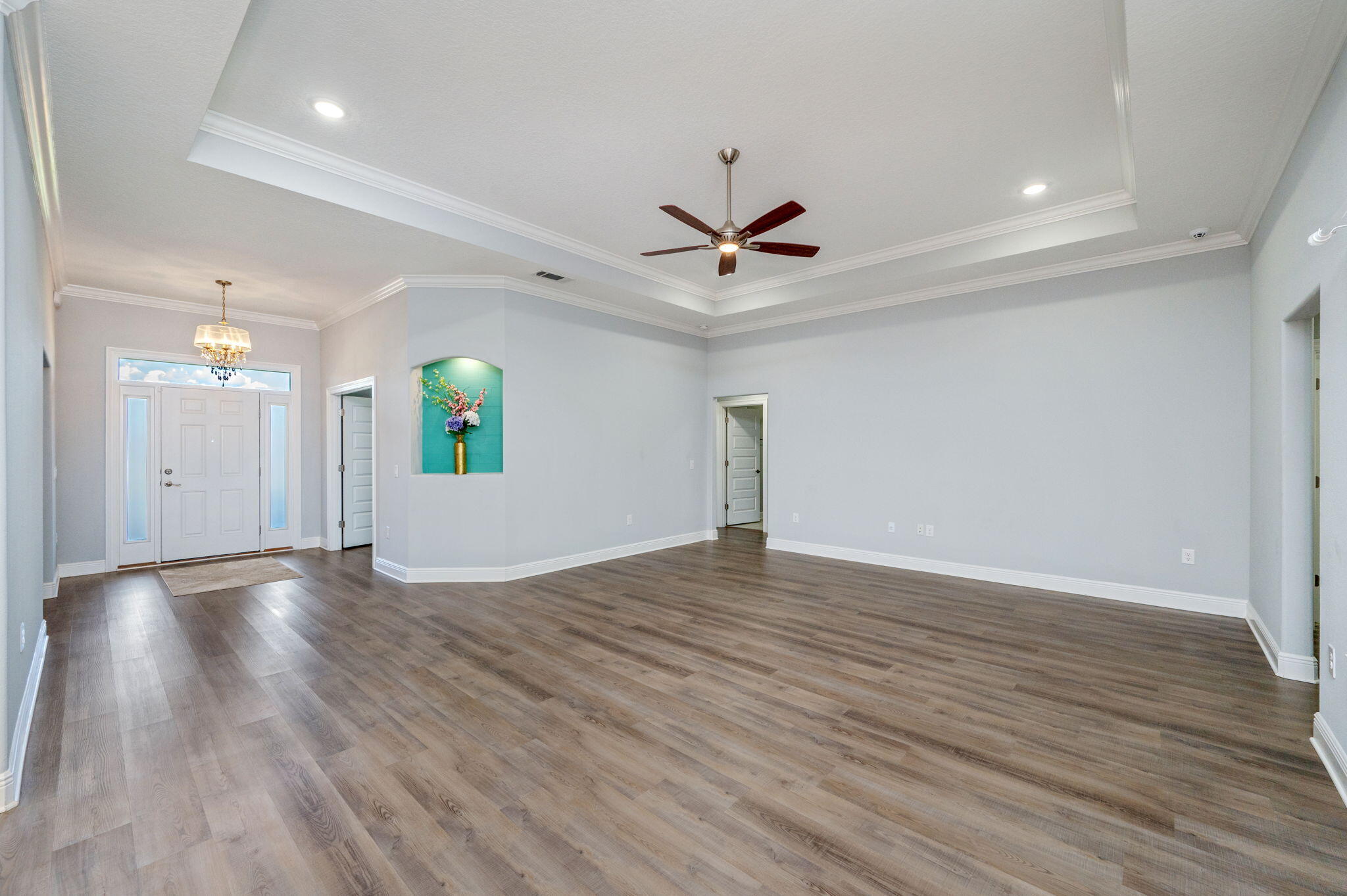 6125 Quintette Road Pace, FL 32571 - Photo 15 of 71 a view of an empty room with window and wooden floor