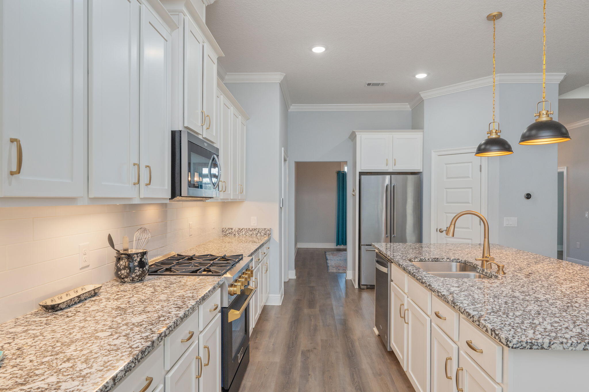 6125 Quintette Road Pace, FL 32571 - Photo 20 of 71 a kitchen with stainless steel appliances granite countertop a sink stove and refrigerator