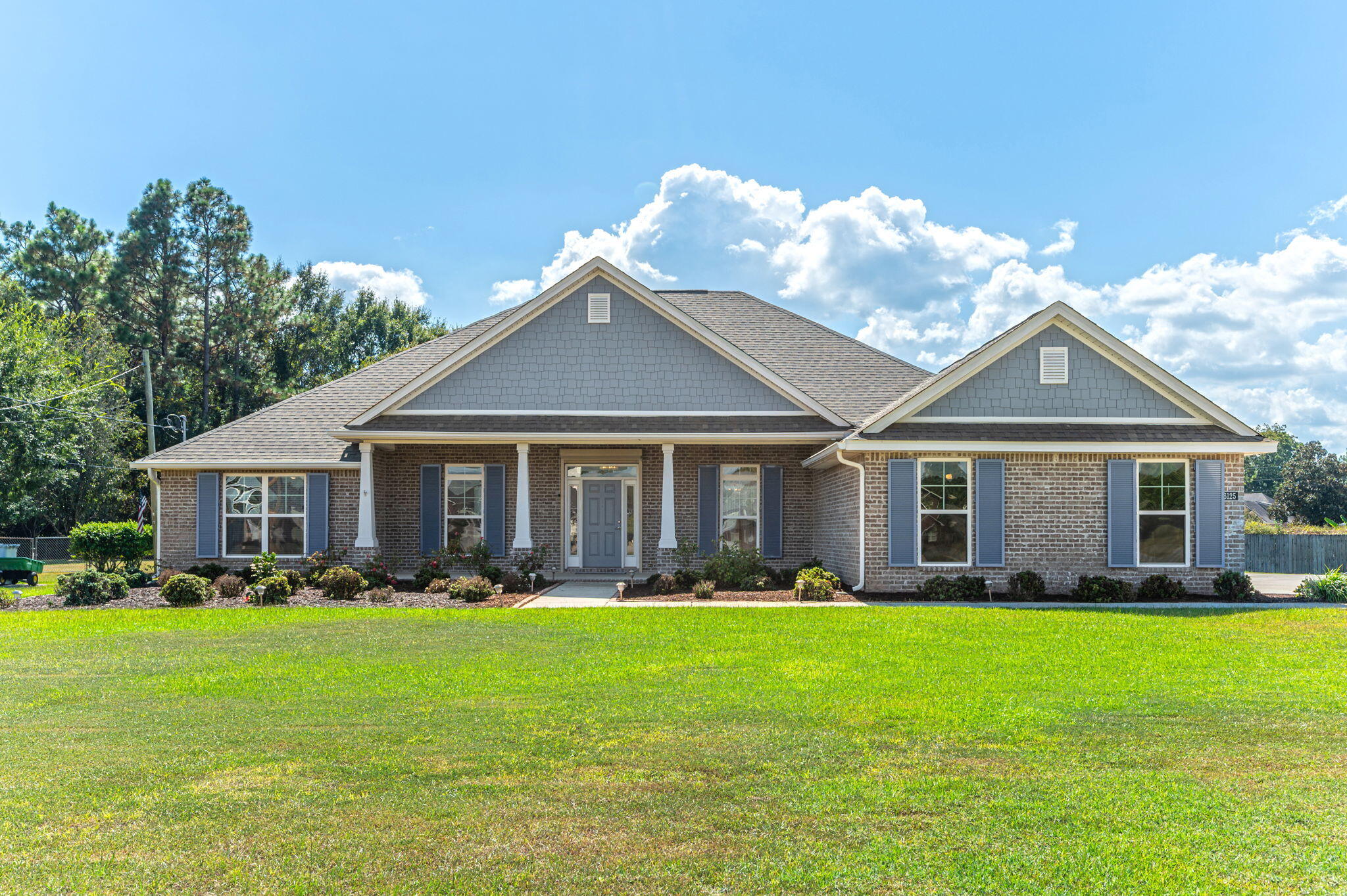 6125 Quintette Road Pace, FL 32571 - Photo 2 of 71 a front view of house with yard and green space