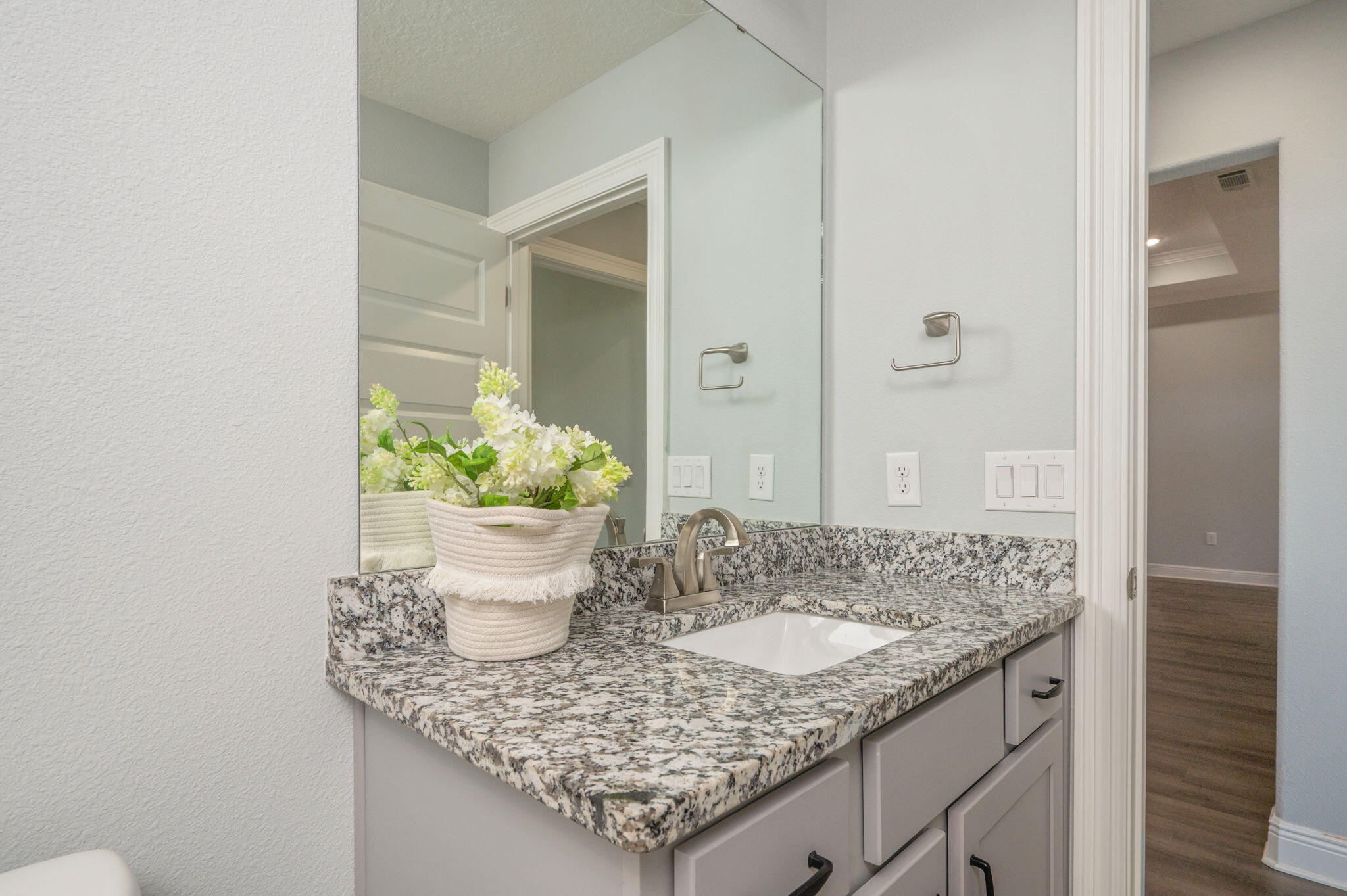6125 Quintette Road Pace, FL 32571 - Photo 45 of 71 a bathroom with a granite countertop sink and a mirror