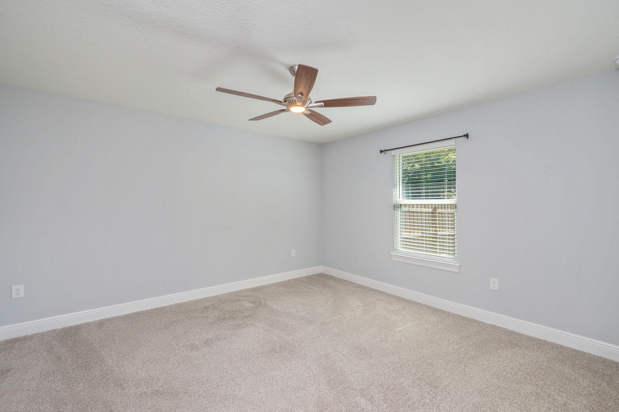6125 Quintette Road Pace, FL 32571 - Photo 47 of 71 an empty room with a window and a fan