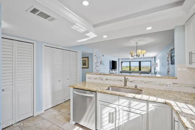 a kitchen with stainless steel appliances granite countertop a stove a refrigerator and a microwave