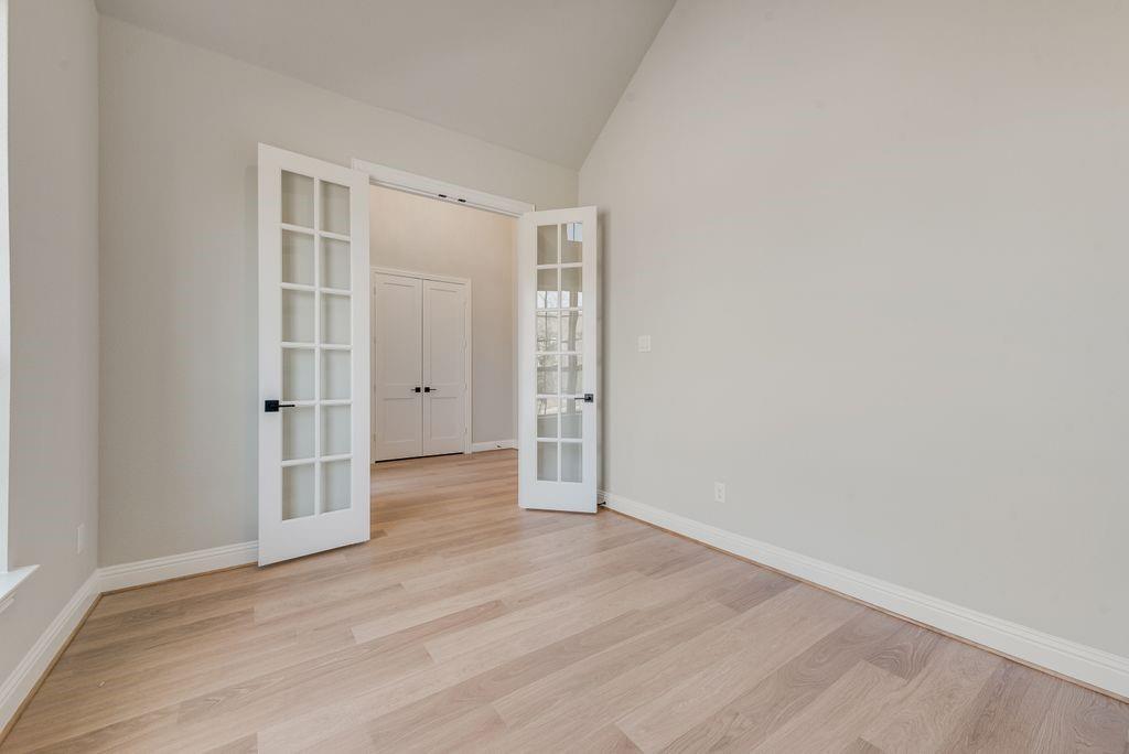 1259 Calebria Way Fate, TX 75087 - Photo 13 of 38 wooden floor and white walls