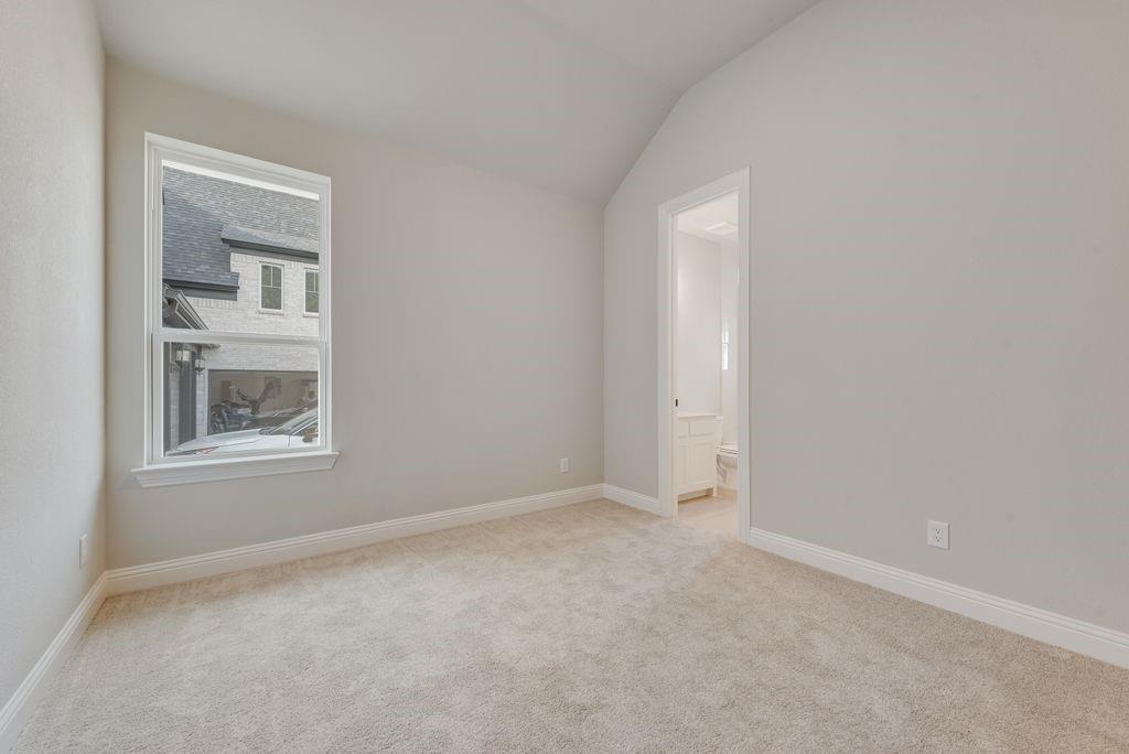 1259 Calebria Way Fate, TX 75087 - Photo 20 of 38 an empty room with windows and closet
