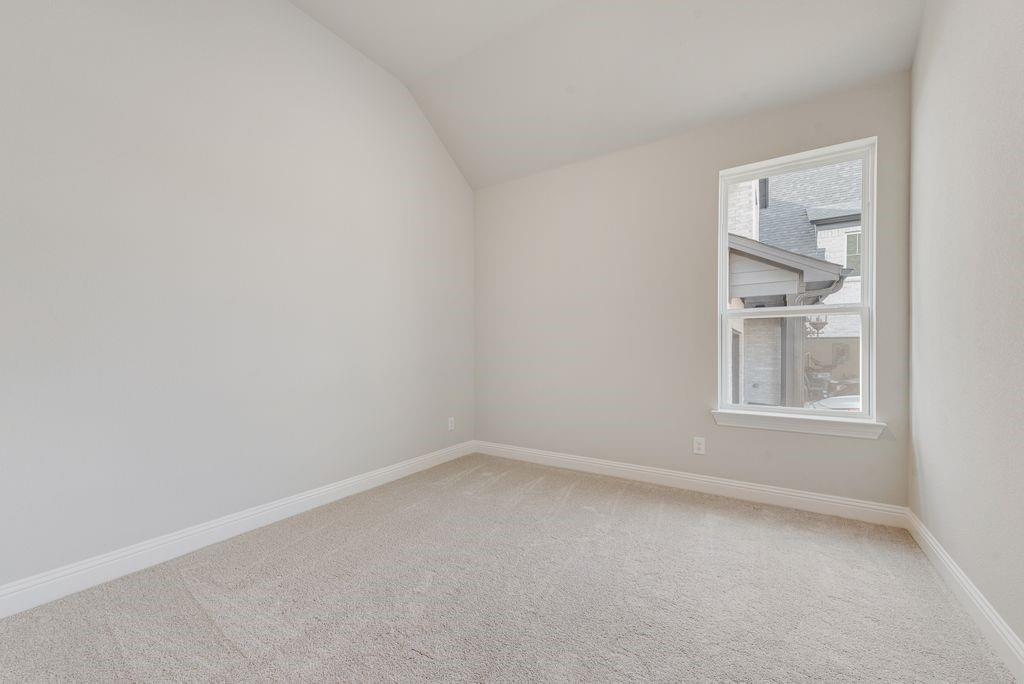 1259 Calebria Way Fate, TX 75087 - Photo 22 of 38 an empty room with a window