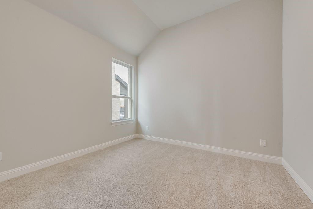1259 Calebria Way Fate, TX 75087 - Photo 24 of 38 a view of an empty room with a window