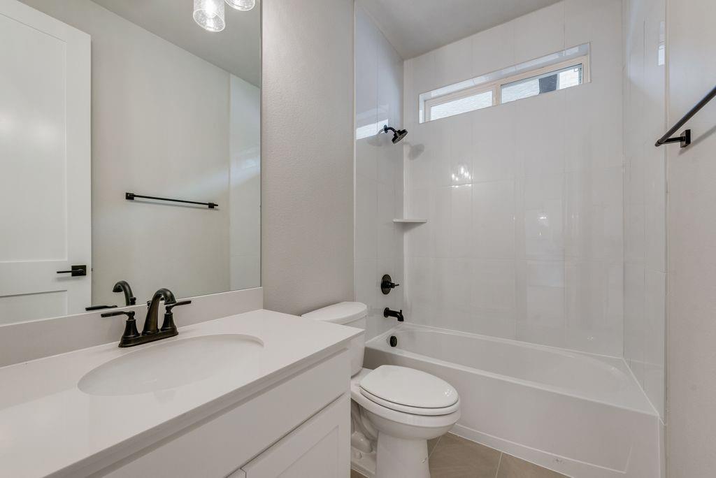 1259 Calebria Way Fate, TX 75087 - Photo 25 of 38 a bathroom with a sink a toilet and a bathtub