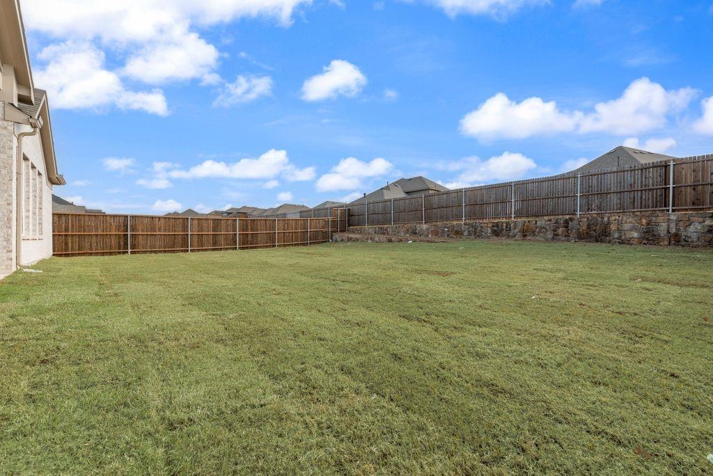 1259 Calebria Way Fate, TX 75087 - Photo 27 of 38 a view of a backyard