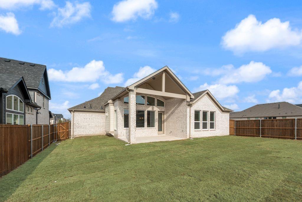 1259 Calebria Way Fate, TX 75087 - Photo 28 of 38 a front view of a house with a garden