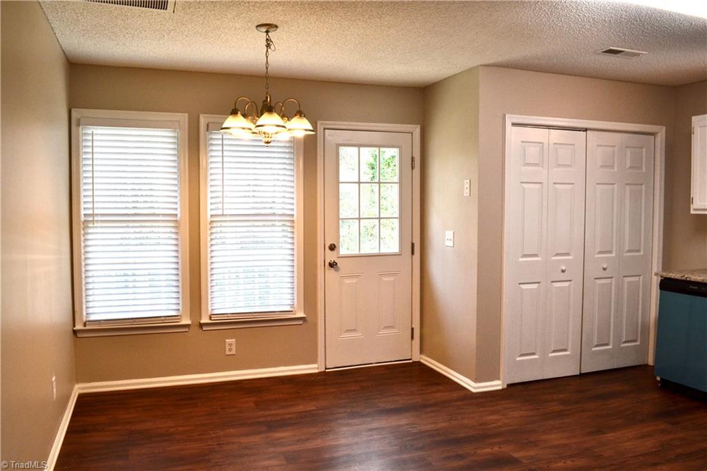 410 Shadybrook Road High Point, NC 27265 - Photo 13 of 43 Dining space with back door that leads out to the NEW wood deck.