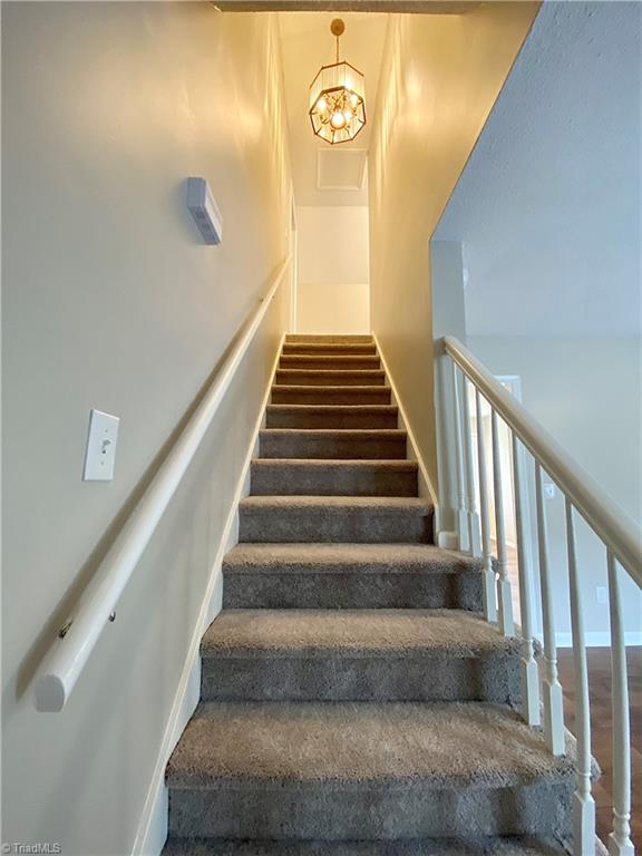 410 Shadybrook Road High Point, NC 27265 - Photo 22 of 43 Newly carpeted stairwell up to two bedrooms and bathroom.