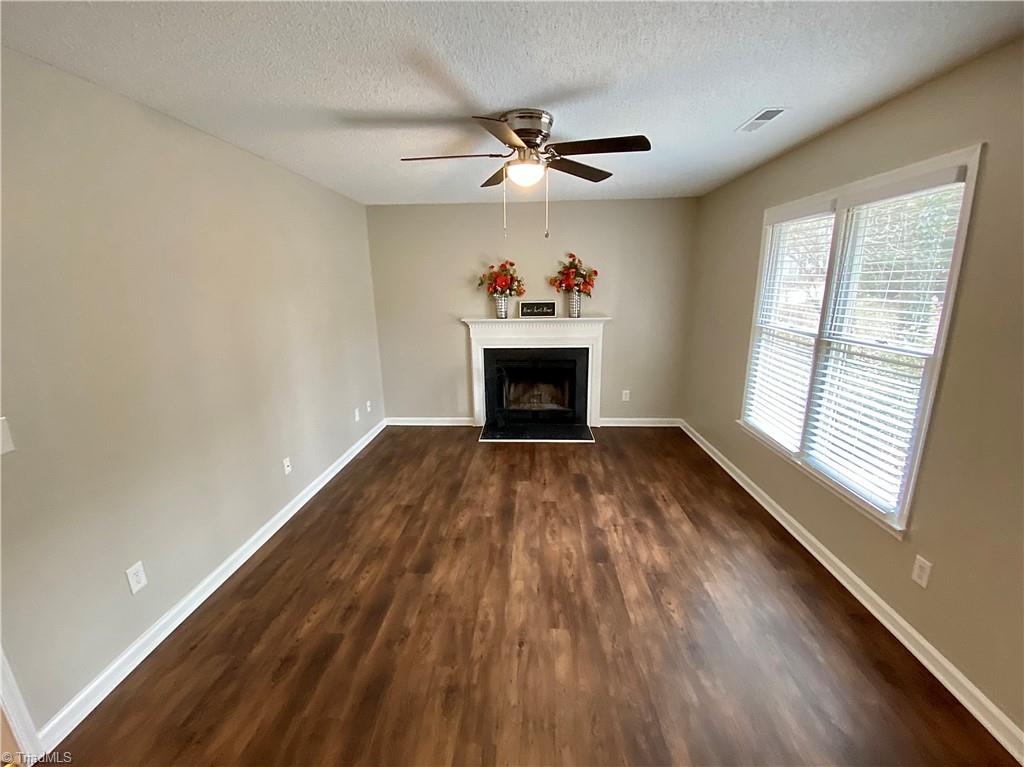 410 Shadybrook Road High Point, NC 27265 - Photo 5 of 43 Living space with wood burning fireplace.