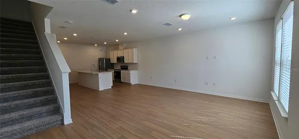a view of a livingroom with a staircase