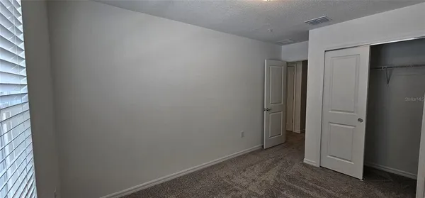 a kitchen with stainless steel appliances a microwave a sink and cabinets