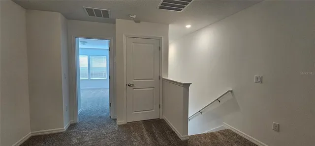 a kitchen with stainless steel appliances a refrigerator and a stove top oven
