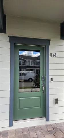 a view of street with houses and trees in the background