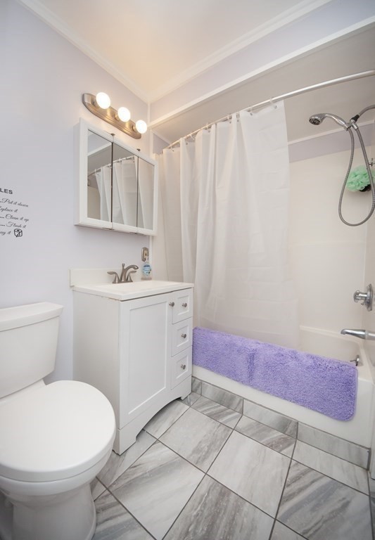 4 Fay Place Haverhill, MA 01830 - Photo 13 of 25 a bathroom with a sink a toilet and mirror