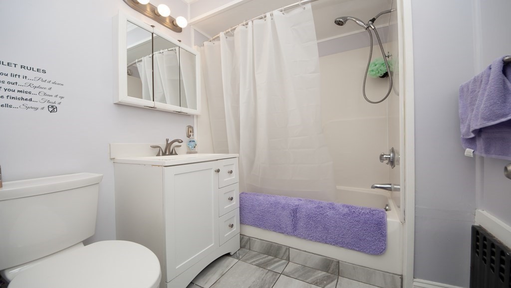 4 Fay Place Haverhill, MA 01830 - Photo 14 of 25 a bathroom with a granite countertop bathtub sink vanity and toilet