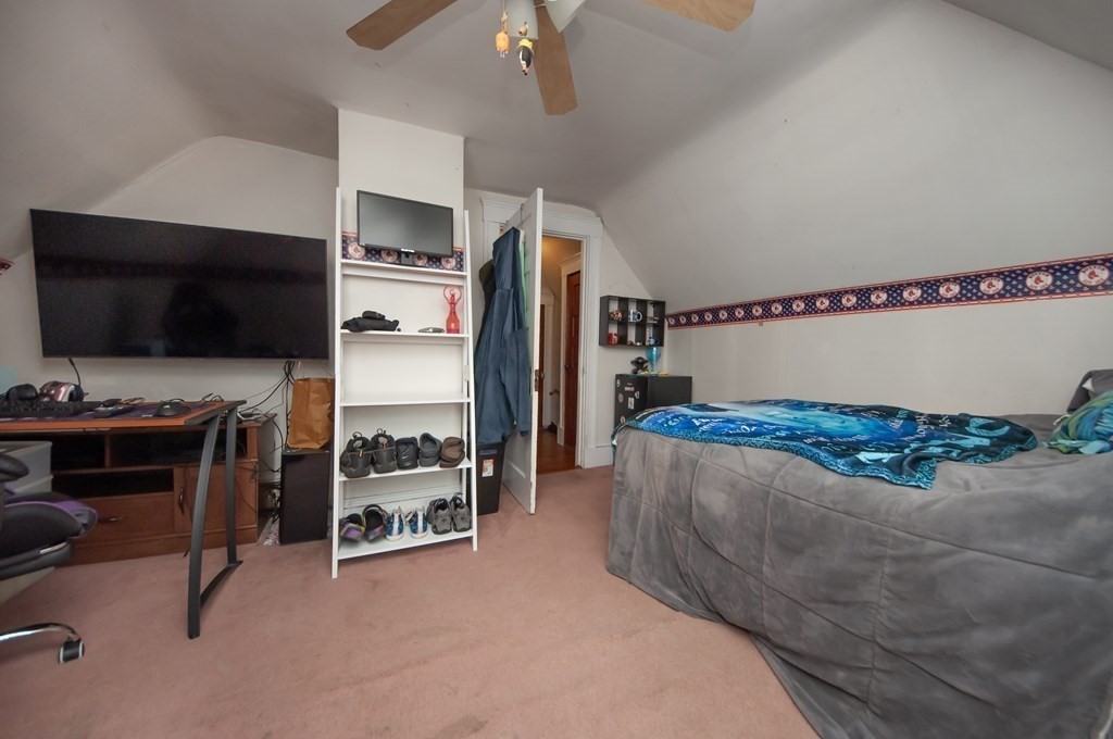 4 Fay Place Haverhill, MA 01830 - Photo 19 of 25 a living room with furniture and a flat screen tv