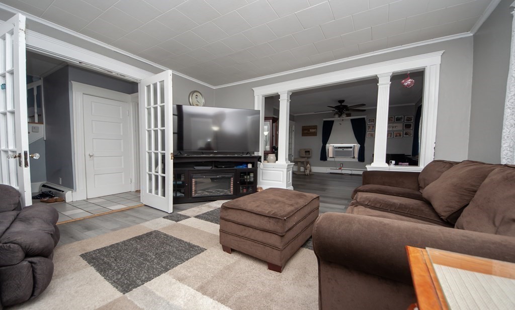 4 Fay Place Haverhill, MA 01830 - Photo 8 of 25 a living room with furniture and a flat screen tv