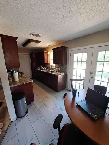 a living room with furniture rug and window
