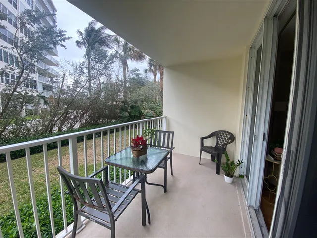a view of a balcony with chairs