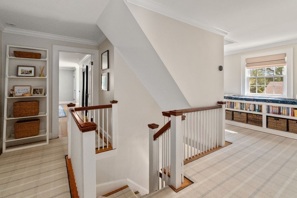 115 Bright Road Belmont, MA 02478 - Photo 11 of 22 a view of a hallway with wooden floor and staircase