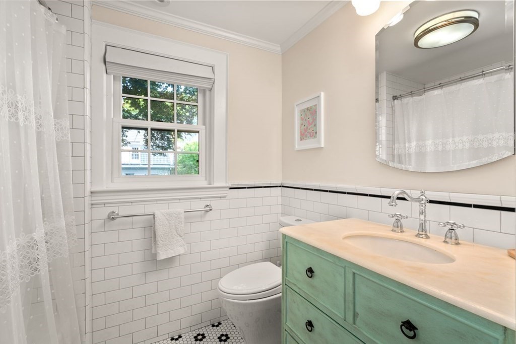 115 Bright Road Belmont, MA 02478 - Photo 18 of 22 a bathroom with a granite countertop toilet sink and mirror