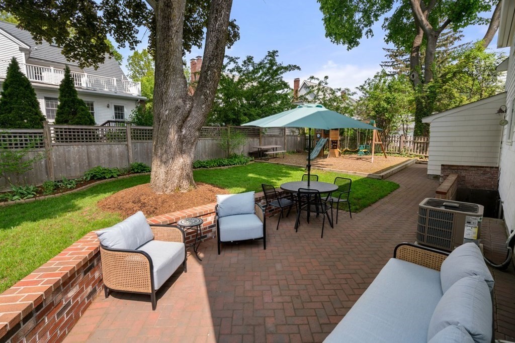 115 Bright Road Belmont, MA 02478 - Photo 21 of 22 a view of a patio with couches under an umbrella