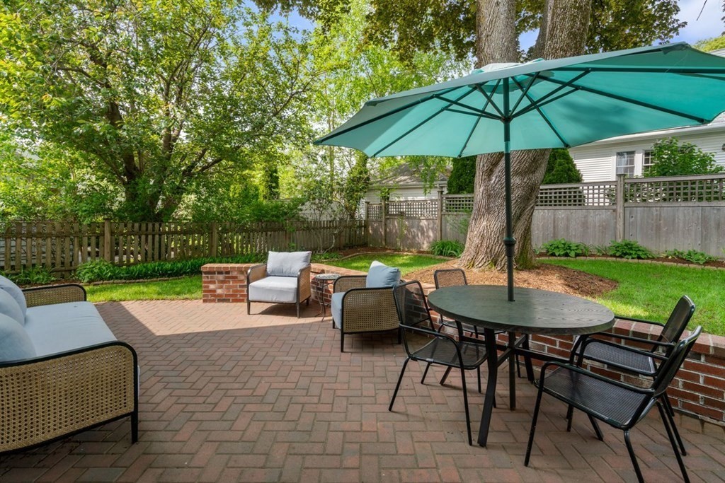 115 Bright Road Belmont, MA 02478 - Photo 22 of 22 a view of backyard with outdoor seating a patio and a garden