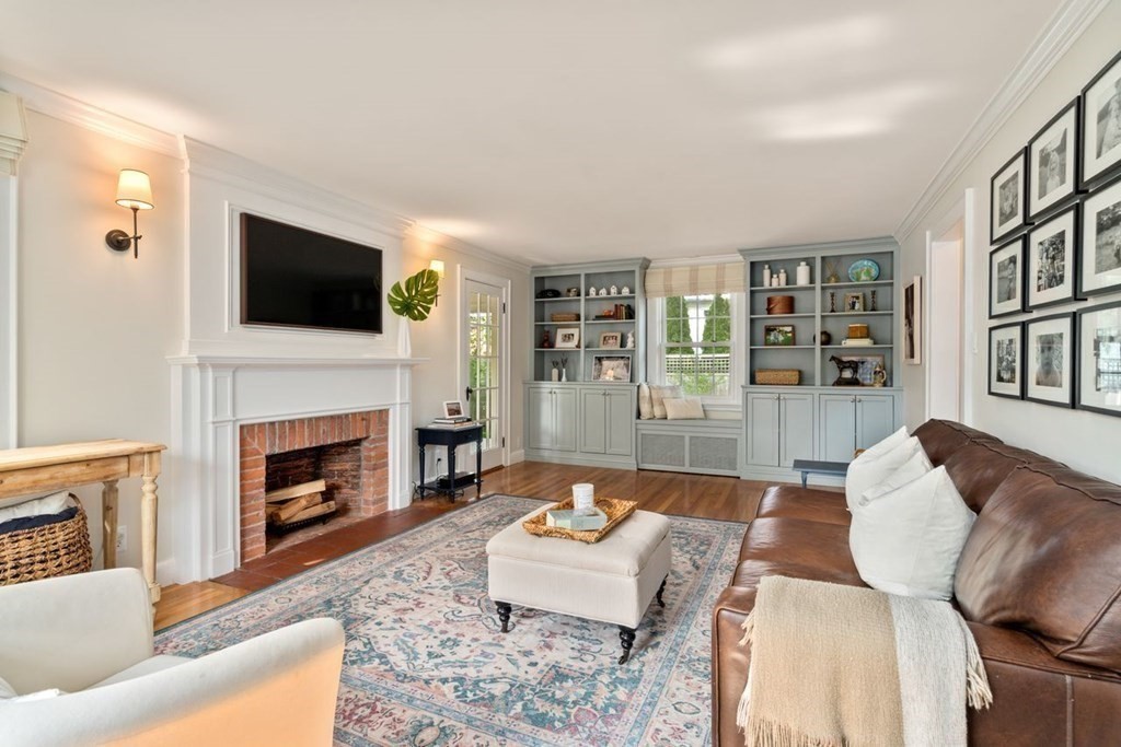 115 Bright Road Belmont, MA 02478 - Photo 3 of 22 a living room with furniture a fireplace and a flat screen tv
