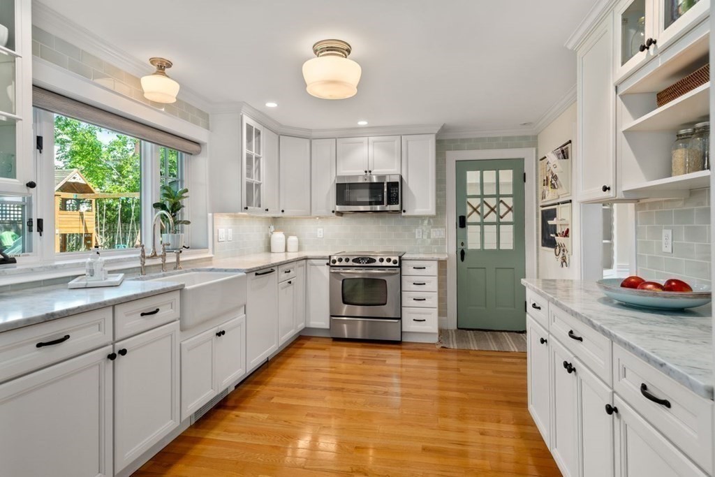 115 Bright Road Belmont, MA 02478 - Photo 6 of 22 a large kitchen with stainless steel appliances granite countertop a stove and a sink
