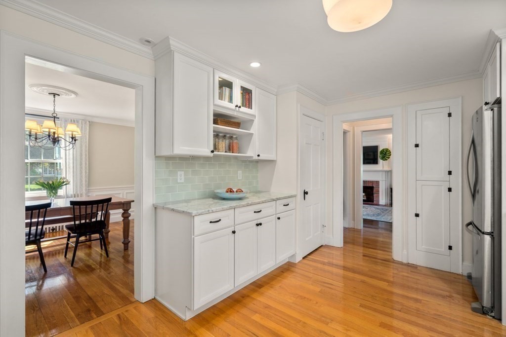 115 Bright Road Belmont, MA 02478 - Photo 8 of 22 a kitchen with granite countertop a stove a sink and a refrigerator